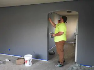 hired painter painting the house interior dark grey - south shore painting contractors