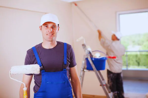 house painter holding equipment