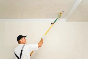 Young Painter Painting the Ceiling House painter painting residential home interior Painting walls and ceilings